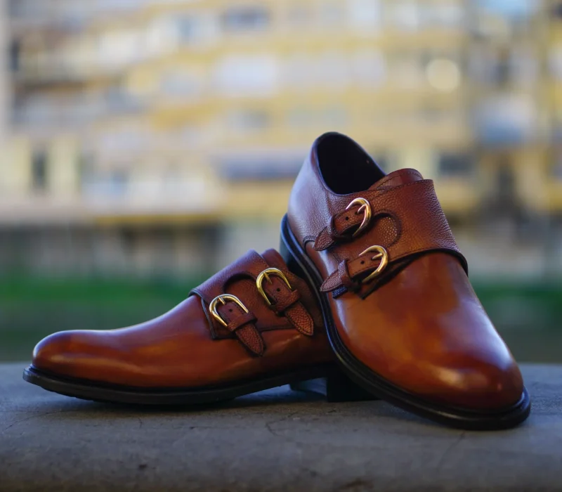close-up-brown-shoes-retaining-wall-min